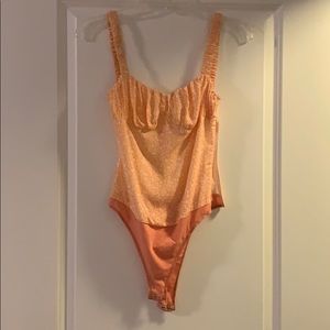 Lani the Label peach Bloom body suit